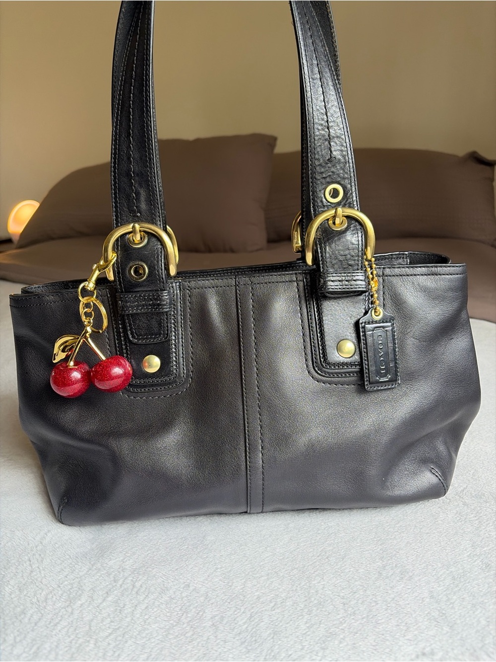 Coach Black Leather Shoulder Bag with Gold Hardware and Cherry Charm